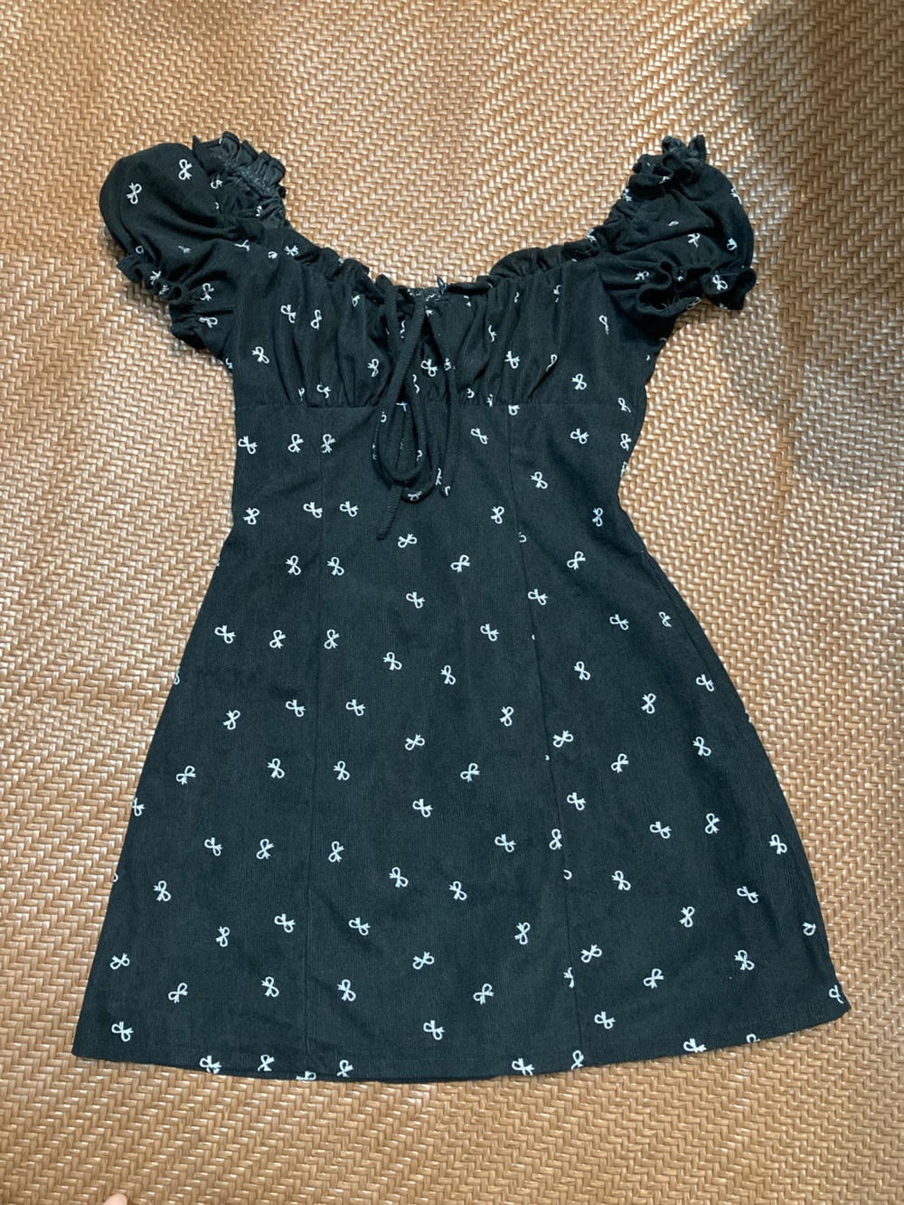Black Off-Shoulder Tie-Front Tunic with White Bow Print